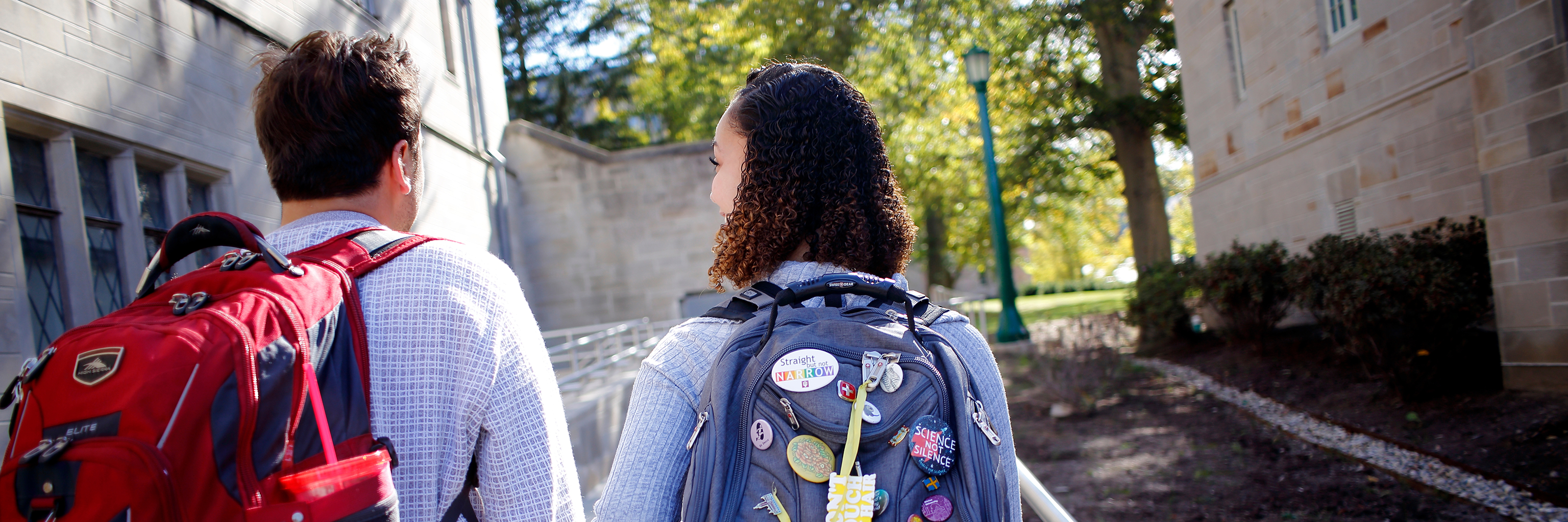 Two students walk through the Indiana University Bloomington campus.