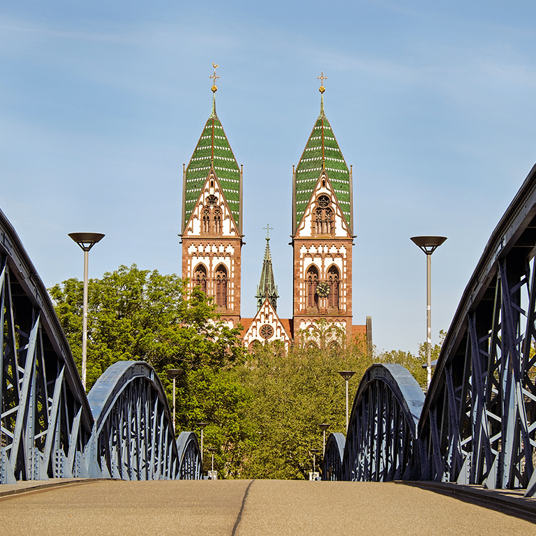 Bridge and steeples seen in Freiburg, Germany.