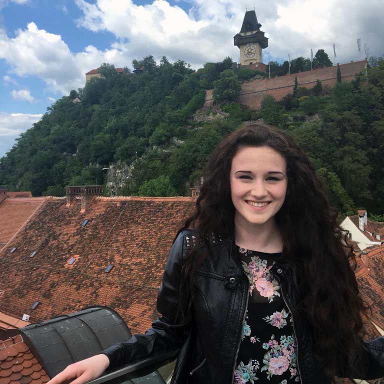Student in front of historic German buildings