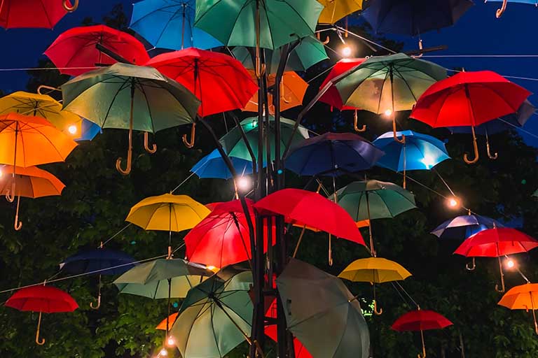 hundreds of floating umbrellas in different colors