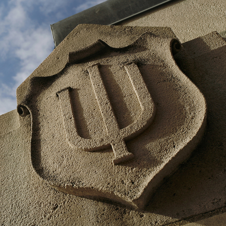 Stone carving of the Indiana University seal